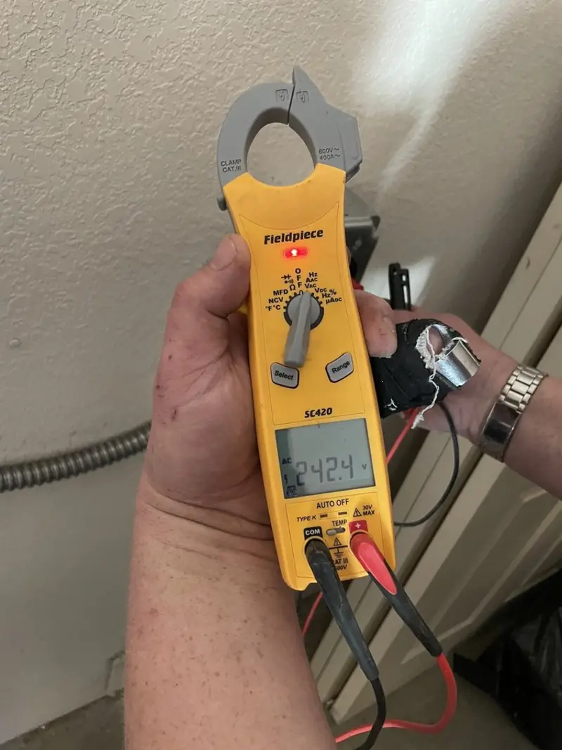 Voltage testing with clamp meter during Ceiling Fan Installation in Diamondhead